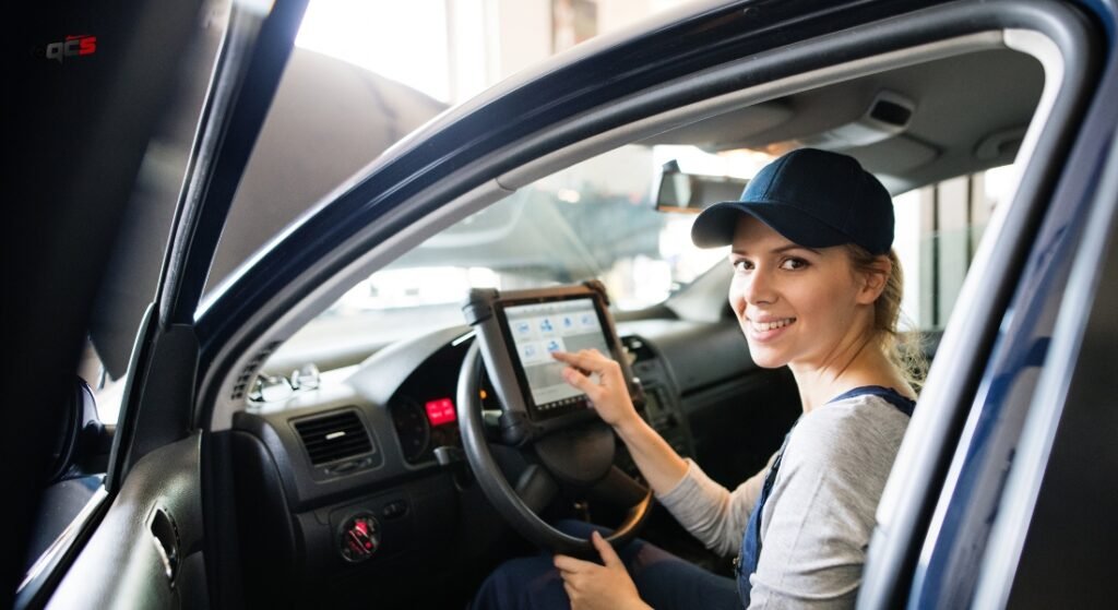 Women completing car diagnosis checkup