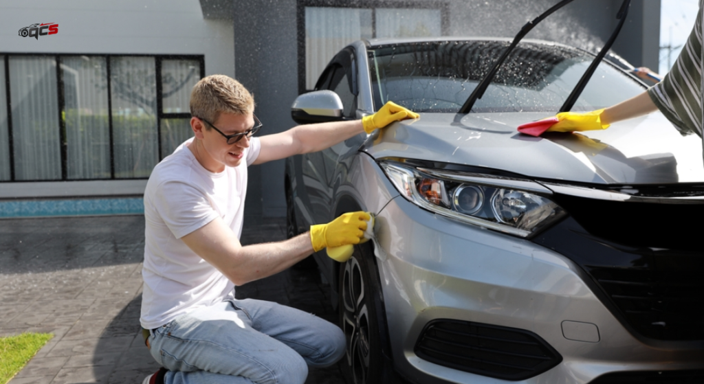 A person washing a car 